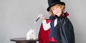 Child illusionist with cute rabbit Child illusionist with cute rabbit